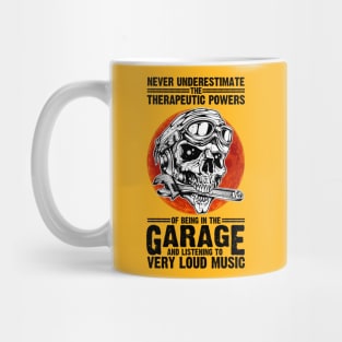 NEVER UNDERESTIMATE THE THERAPEUTIC POWER OF BEING IN THE GARAGE AND LISTENING TO VERY LOUD MUSIC T-shirt Mug